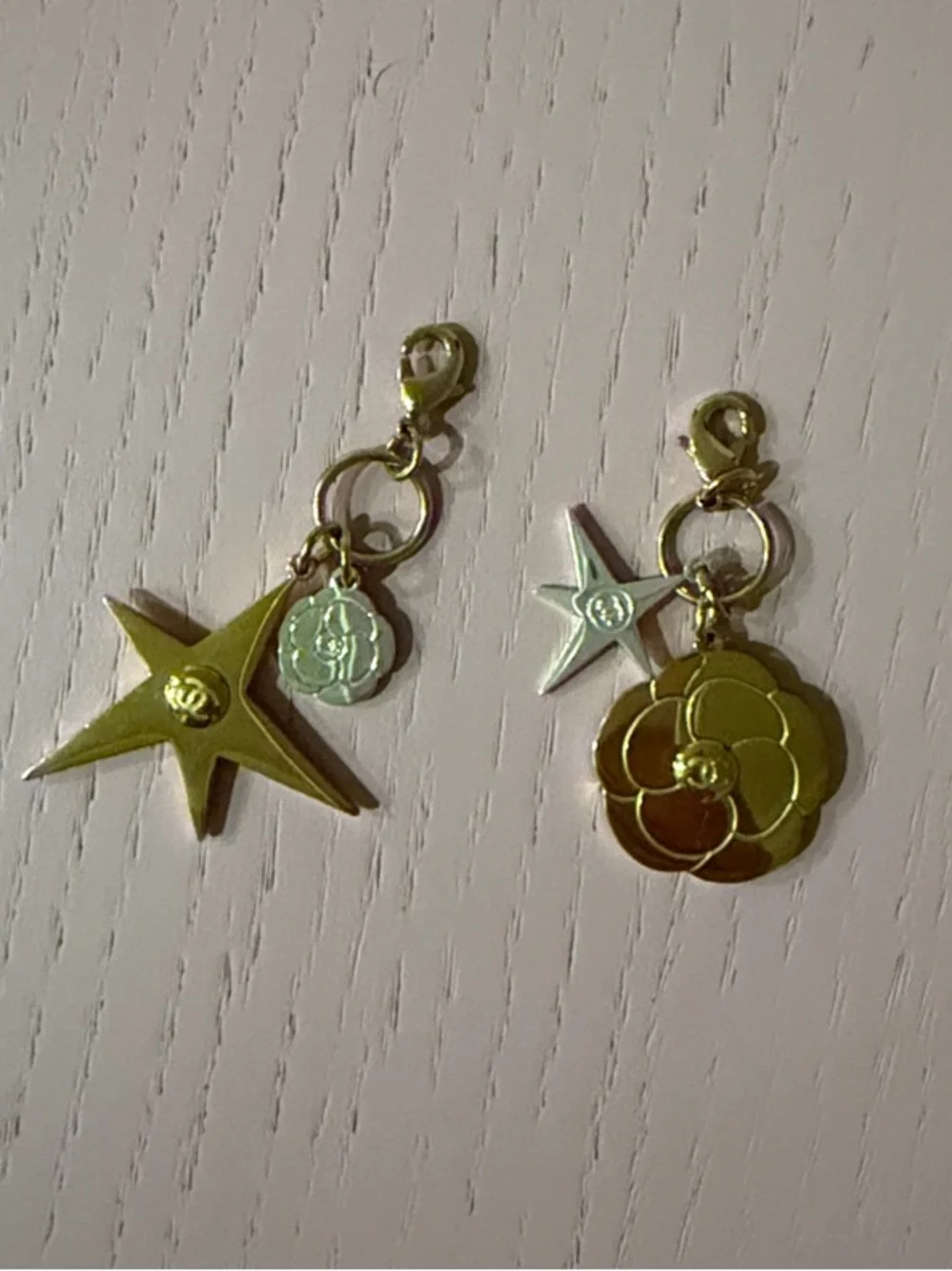 CHANEL Gold-Tone Star and Camellia Charm Pair